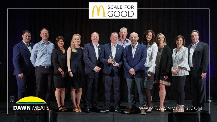 Members of the Dawn Meats team receive the Scale for Good Award from McDonald's