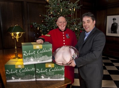 Talking turkey: Chelsea pensioner Dave Thomson thanks farmer Rob Caldecott for his seasonal gift 