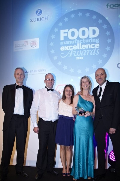 Representatives from Border Biscuits receive the award from TV chef, Simon Rimmer
