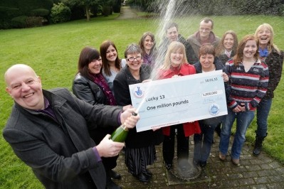 All in a fizz: A group of workers at Bakkavor's soups factory at Spalding is celebrating its £1M lottery win