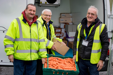 Pictured with a van of donated food is Frank Bowker from Leigh Caring Kitchen (centre) with two FareShare volunteers  