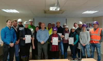 Staff show off their Butchery Academy certificates