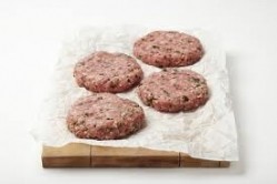 Paragon Quality Foods said claims its halal lamb burgers were contaminated with pork had 'unfairly damaged its good reputation'