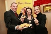 Brian Homewood shares a celebratory cookie with councillor Gail McDade, mayor of Corby Borough, and Louise Mensch, MP for Corby and East Northamptonshire, at the official opening of the new BakeAway facility